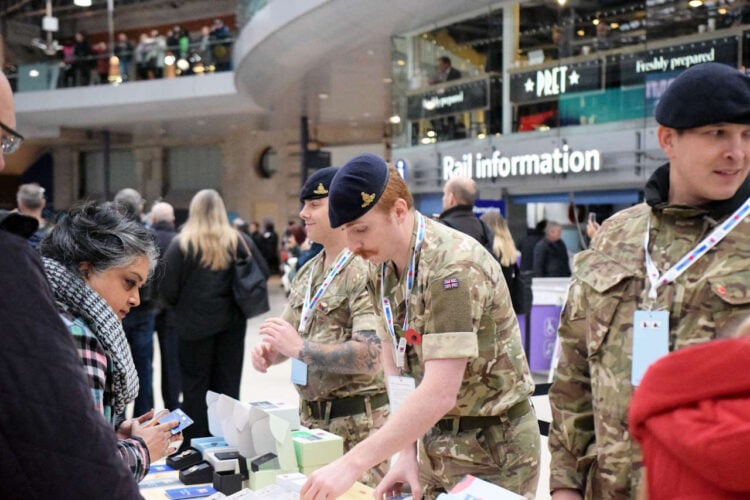 Royal Artillery personnel collecting at Waterloo on London Poppy Day. // Credit: South Western Railway