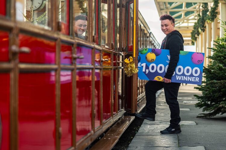 Neil gets onboard with his £1 million win! // Credit: National Lottery