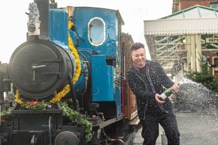 Neil celebrating his win in style at the Tallylyn Railway // Credit: National Lottery