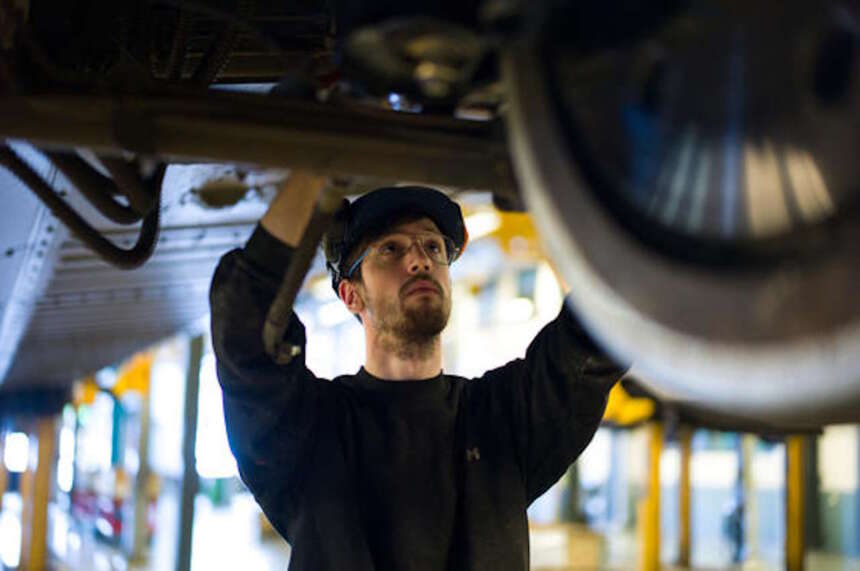 Alstom employee, Magnus Svensson,works on a train in maintenance depot, Bro, Stockholm, Sweden