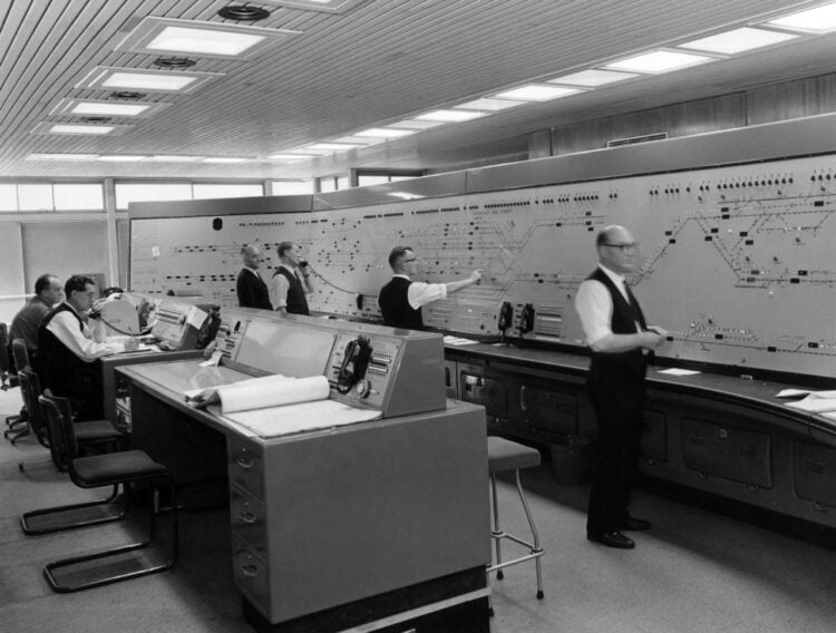 Birmingham New Street signal box, Circa 1966 The interior of New Street signal box. Operators are working on route-setting panel and central control desk