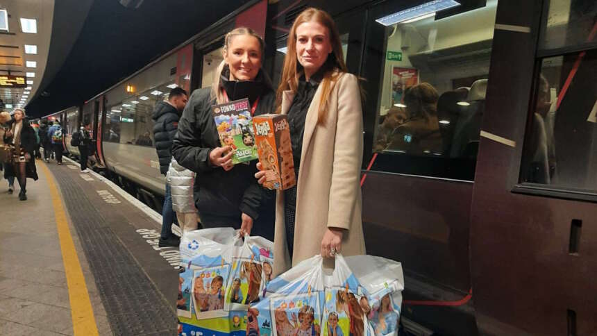 Caitlin Willson and Clare Shaw delivering presents