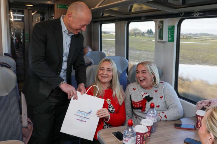 Chris Jackson welcomes passengers on board the new service from Castleford to York with goody bags