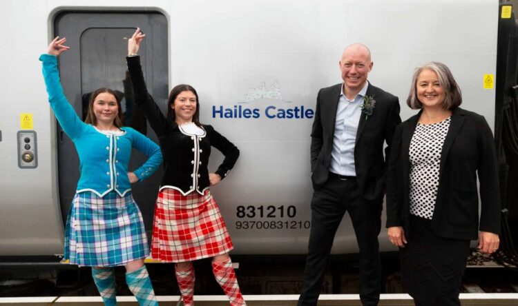 Highland dancers, Chris Jackson, Managing Director of TPE and Rachel Sydeserff, Historic Environment Scotland's District Visitor and Community Manager with the newly named Hailes Castle train 