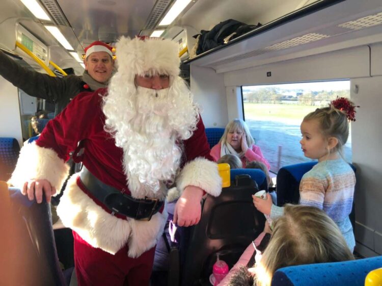 Father Christmas spreading festive cheer on a Northern train