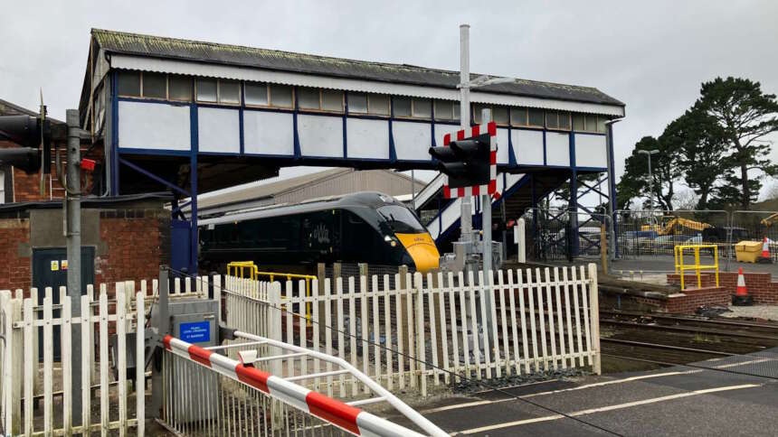 GWR train at Truro station with level crossing that will be upgraded