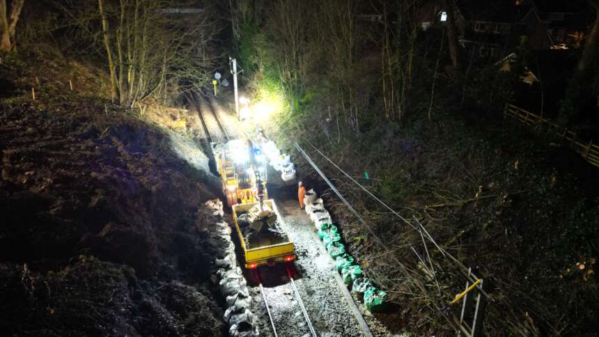 Specialist rail vehicles work to remove soil from landslip in Baildon, Network Rail