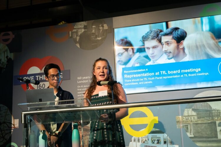 TfL Youth Panel, launch of report 'Tomorrow's TfL: The Youth Panel's vision for the future', London Transport Museum.  Lauren Price (right) and Ho-Kit Lam presenting report.  October 24, 2023