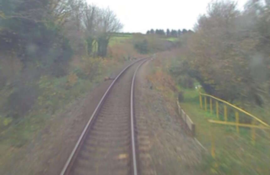 Forward-facing CCTV image from a different train showing the site access point where the near miss took place