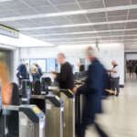 Passengers passing through the ticket barriers at Blackfriars Station