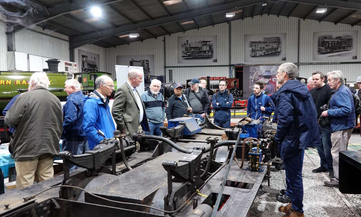 Jeremy Davey with 19B supporters inspect the locomotive chassis at Statfold