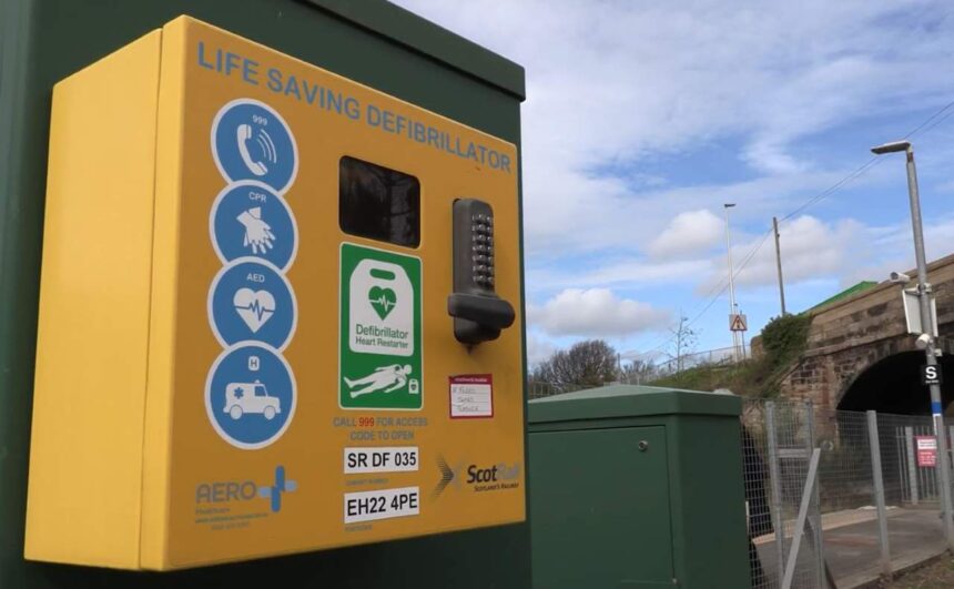A Defibrillator and its case on a platform in Scotland - Scotrail