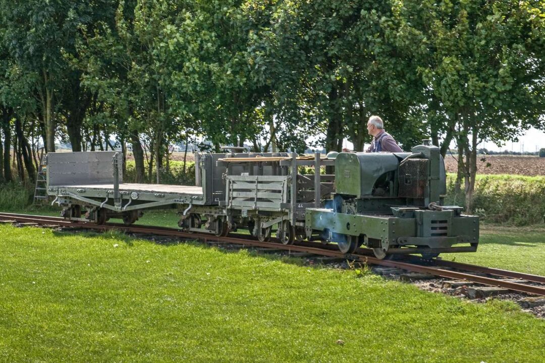 About to return to the task they were built for 108 years ago during World War One, transporting materials across muddy, rain-soaked ground  – trench railway wagons restored by the Lincolnshire Coast Light Railway Historic Vehicles Trust, will take construction materials to the site of the new station 