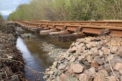 Picture from near Dolgarrog station on the Conwy Valley Line after river flooding washed away ballast on 9 April 2024
