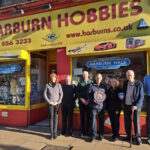 Pictured (L-R) are Harburn Hobbies staff Ann, George, and Ronnie, Ron Jones (Bachmann Europe), Gill & Bob Baird (owners) and Grahame from Harburn Hobbies. // Credit: Bachmann Europe