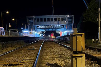 Bridge span is installed at Llanelli station as part of construction of accessible footbridge