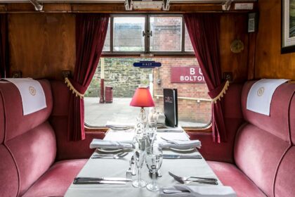 A table set for Father's Day dinner on an East Lancashire Railway train.
