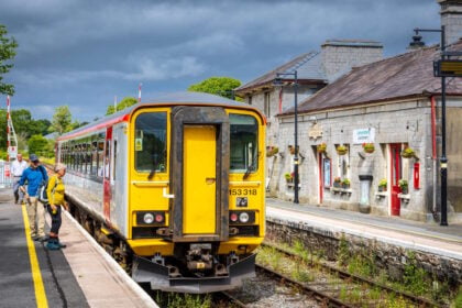 Walkers joining the train at Llandovery station. // Credit: Heart of Wales Line Community Rail Partnership