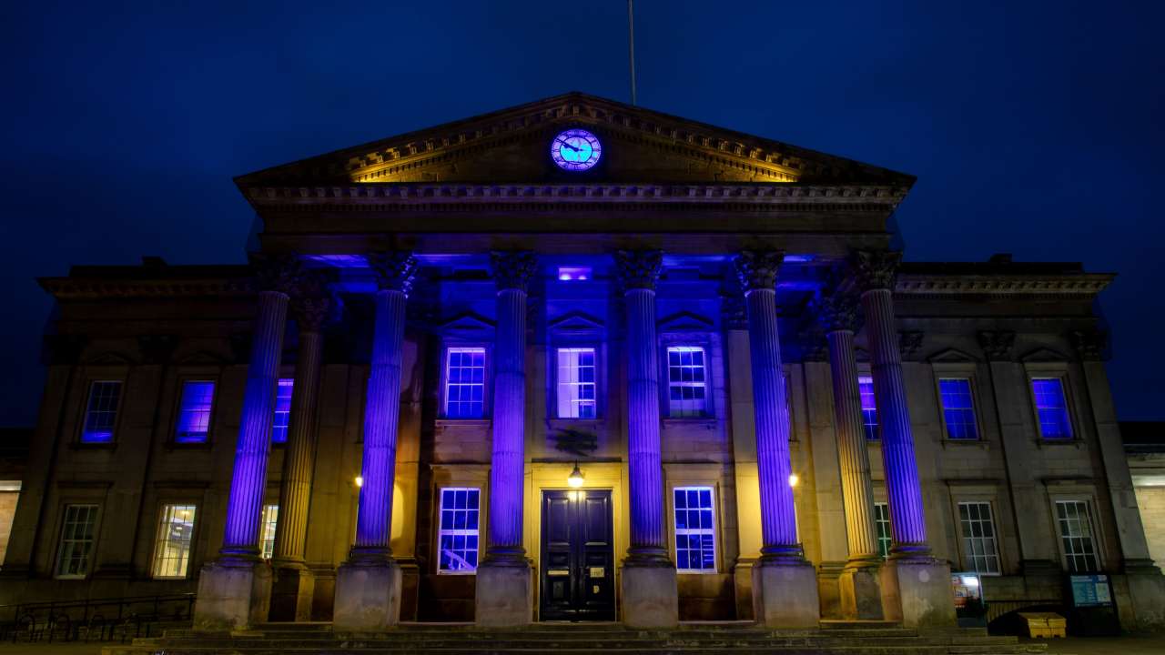 TransPennine Express (TPE) lights up the iconic Huddersfield Train Station in a vibrant blue in support of charity, Shine a Light and Neurofibromatosis Awareness Day.